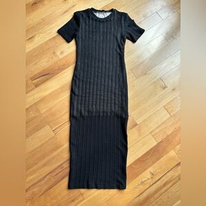 Black, sheer T-shirt, dress with nude viscose liner to the knee.